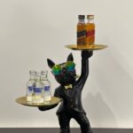 bulldog standing with two trays