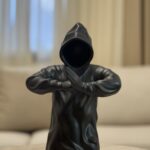 Resin man with crossed arms