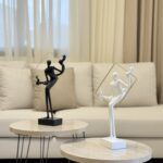 Lady Holding Frame Sculpture