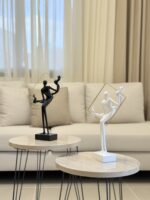 Lady Holding Frame Sculpture