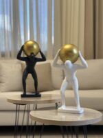 Resin Man with Golden Sphere